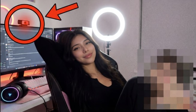 A streamer reclining in her chair after ending a livestream. The webcam in the corner is circled in red.